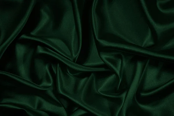 Zöld Háttér Összehajtható Fényes Szövet Felületén Gyönyörű Sötét Háttér Helyet — Stock Fotó