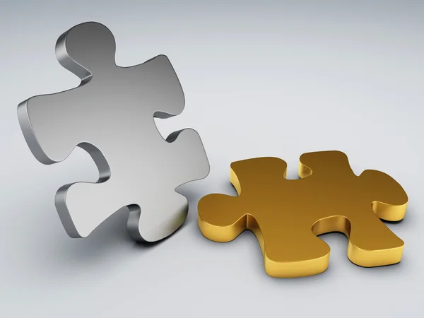 Metal and gold puzzle pieces — Stock Photo, Image