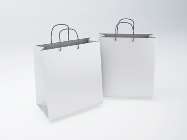 beyaz zemin üzerine beyaz alışveriş torbaları