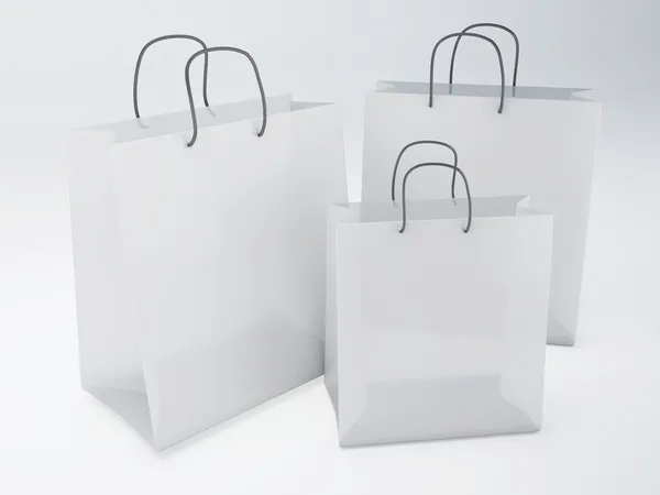 White shopping bags on white background — Stock Photo, Image