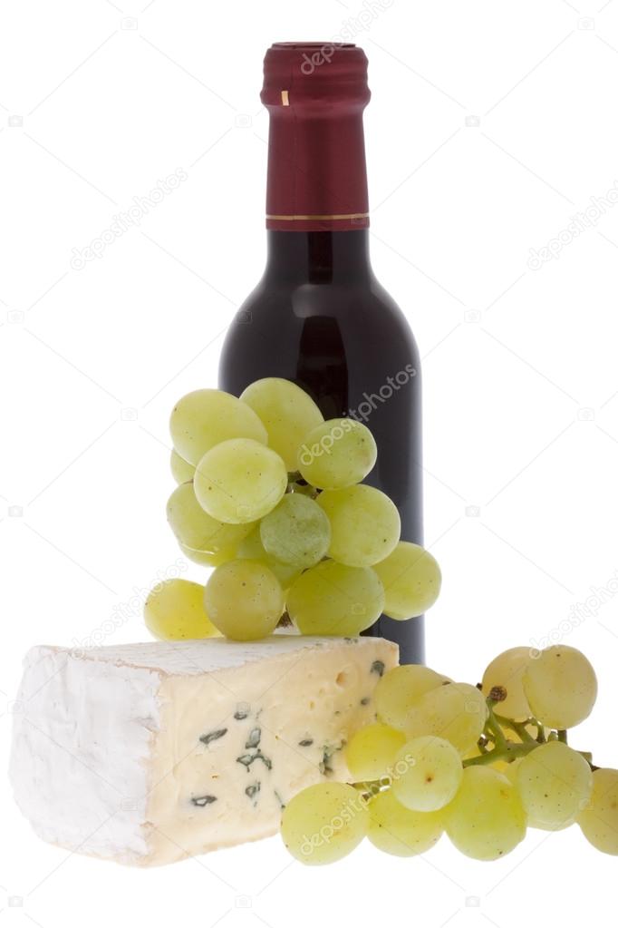 Blue cheese with grapes and a bottle of red wine