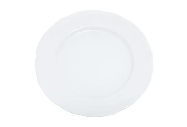 Белая обеденная тарелка с вырезкой — стоковое фото