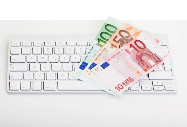 Computer keyboard with money bills