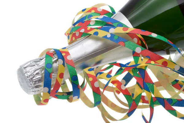Colorful streamers with champagne — Stock Photo, Image