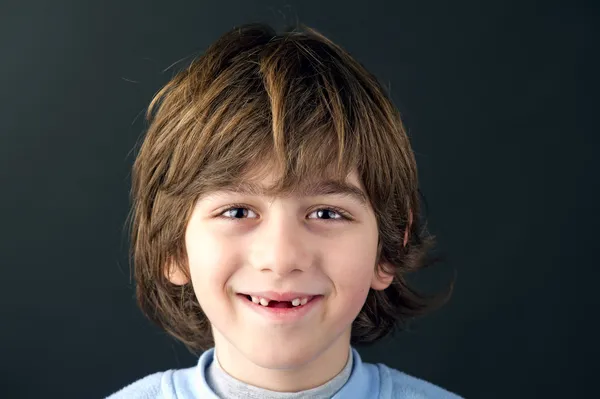 Smiling toothless boy — Stock Photo, Image