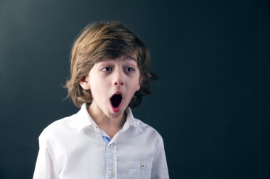 Kid with a shocking expression clipart