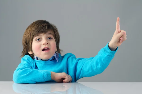 Child raising his finger — Stock Photo, Image