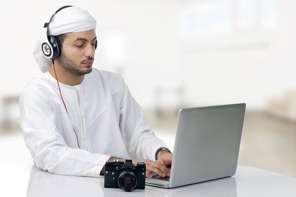 Arabian businessman working on notebook