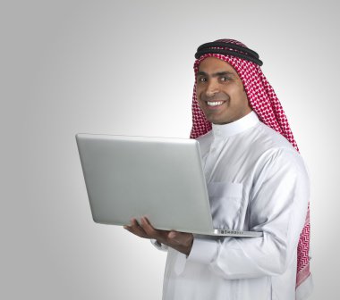 Arabian businessman using laptop clipart