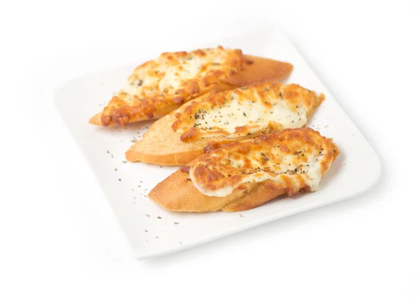 Three pieces of garlic bread topped with cheese — Stock Photo, Image