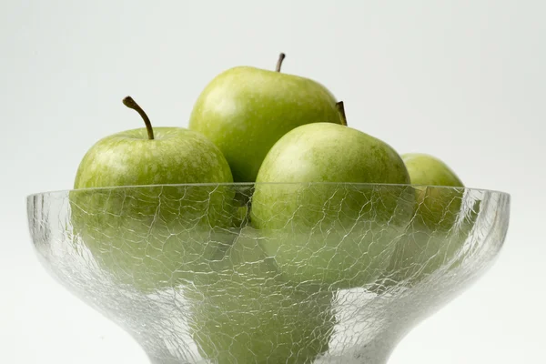 Apples in glass bowl — Stock Photo, Image