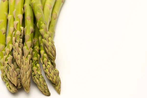 Asperges tips geïsoleerd op een witte achtergrond — Stockfoto