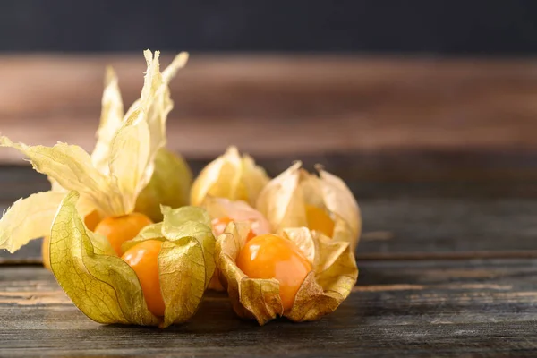 Cape gooseberry or golden berry (Physalis peruviana) on wooden background, Healthy tropical fruit