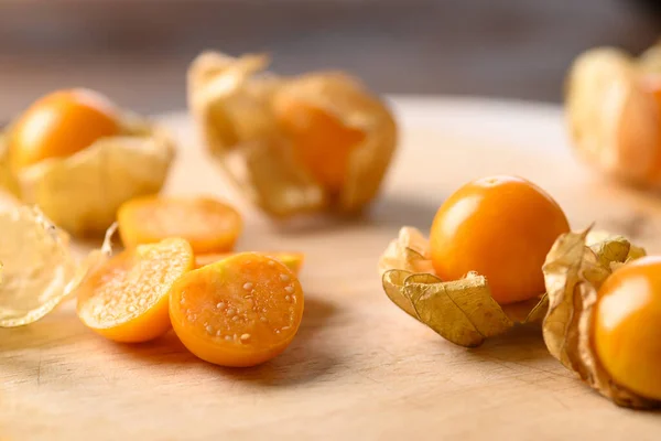 Cape gooseberry or golden berry (Physalis peruviana) on wooden background, Healthy tropical fruit