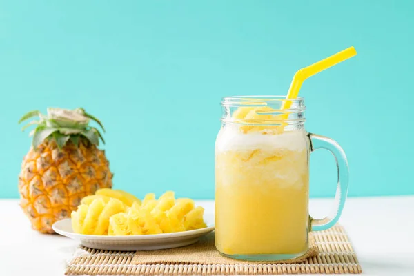 Pineapple smoothie and fresh pineapple fruit on color background, Summer drink