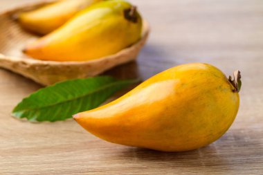 Canistel fruit or Eggfruit on wooden background, Tropical fruit
