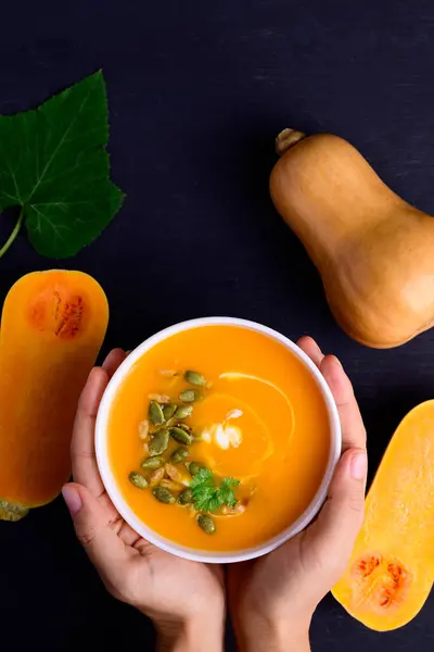 Butternut Squash Pumpkin Soup Bowl Holding Hand Black Background Homemade — Stock Photo, Image