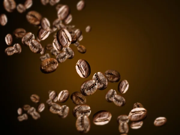 Flying coffee beans — Stock Photo, Image