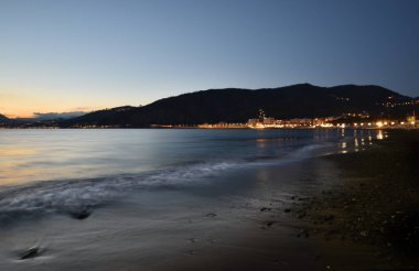 incredible lights and colors, romantic sunset over the sea in Liguria