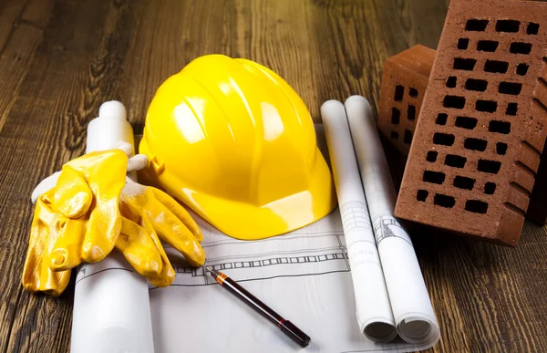 Construction equipment on blueprints — Stock Photo, Image