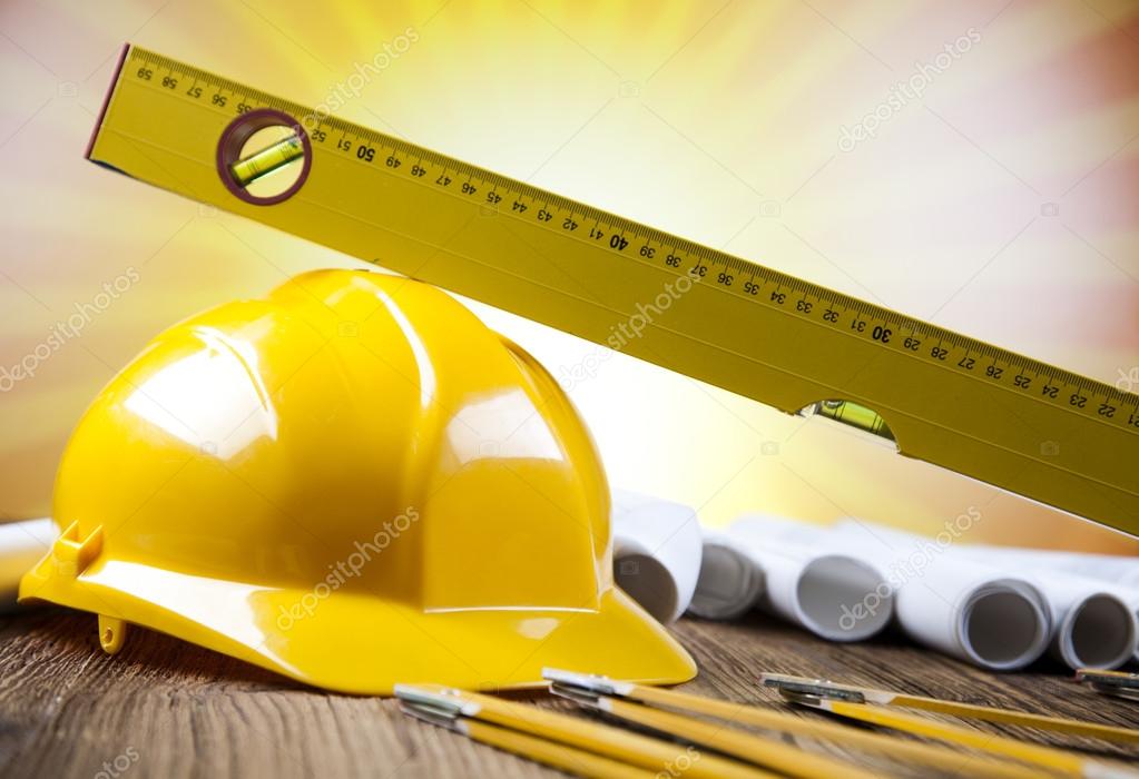 Construction equipment on blueprints Stock Photo by ©dianaduda 41271125