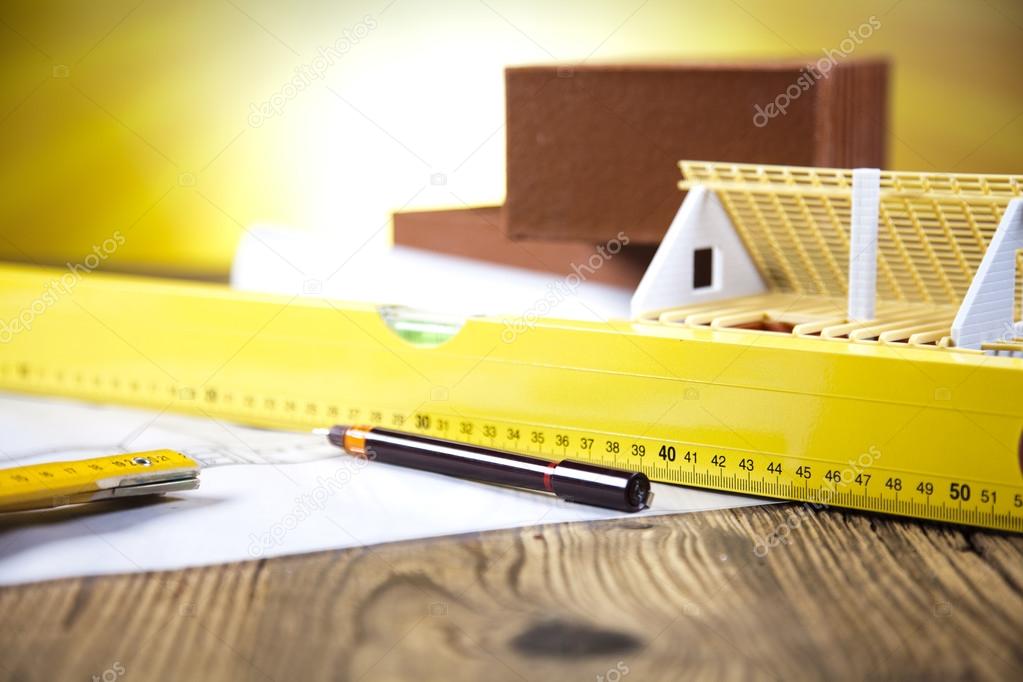 Construction equipment on blueprints Stock Photo by ©dianaduda 41272155