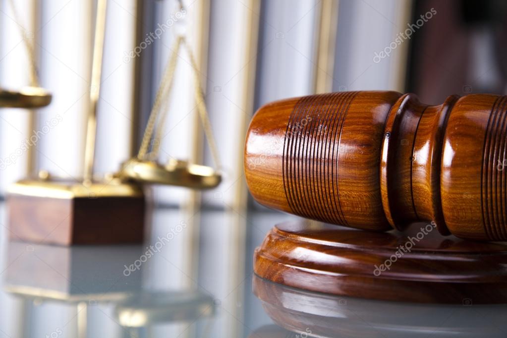 Wooden gavel and book, Statue of Lady Justice, hourglass