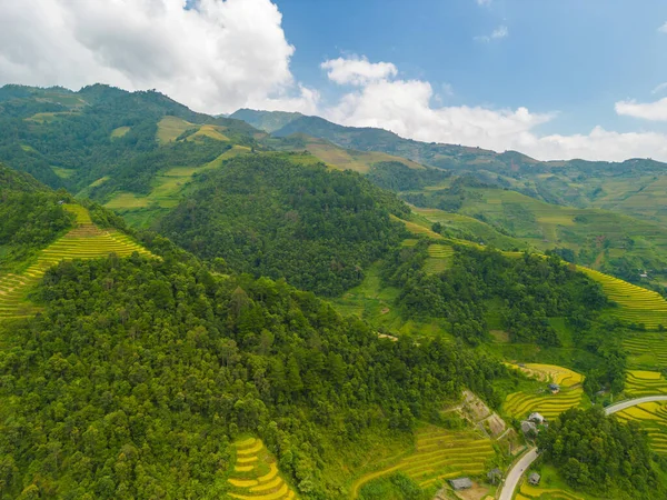 Aerial view of golden rice terraces at Mu cang chai town near Sapa city, north of Vietnam. Beautiful terraced rice field in harvest season in Yen Bai, Vietnam. Travel and landscape concept. Selective focus