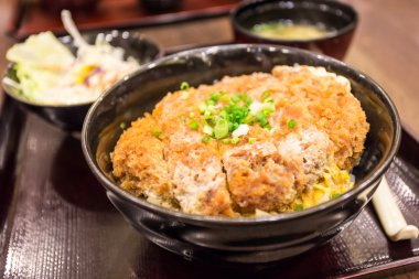 Katsudon - Japanese breaded deep fried pork cutlet (tonkatsu) to clipart