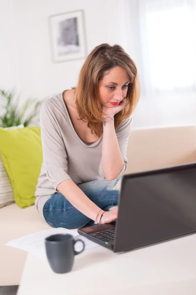 Beautiful young woman at home — Stock Photo, Image