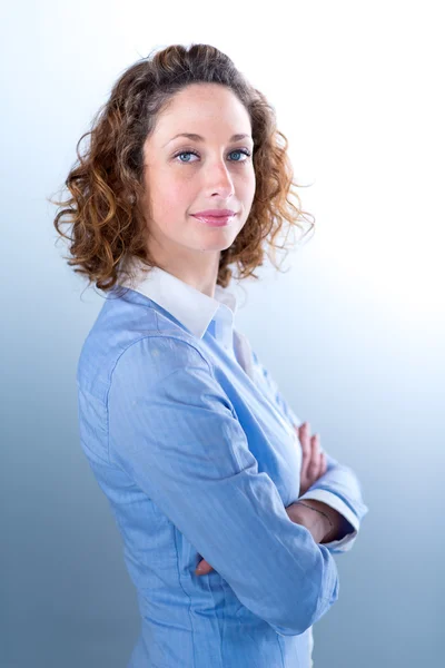 Portrait of a young executive woman on light backgroung — Stock Photo, Image