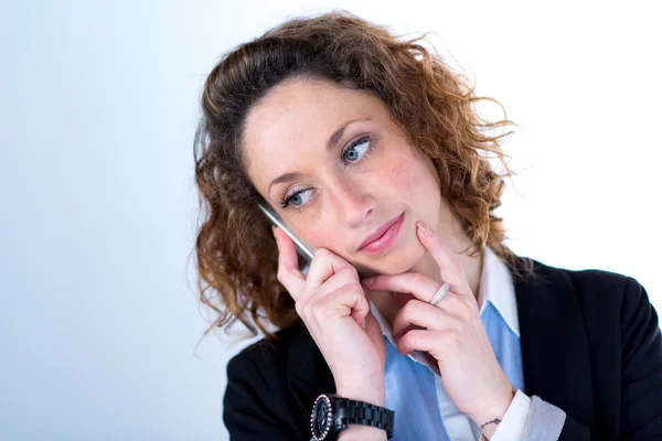 Portrait of a young executive woman on light backgroung — Stock Photo, Image