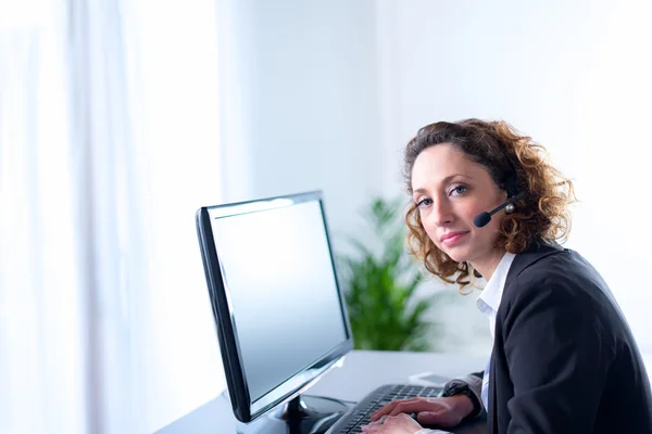 Portrait of an attractive young woman operator — Stock Photo, Image
