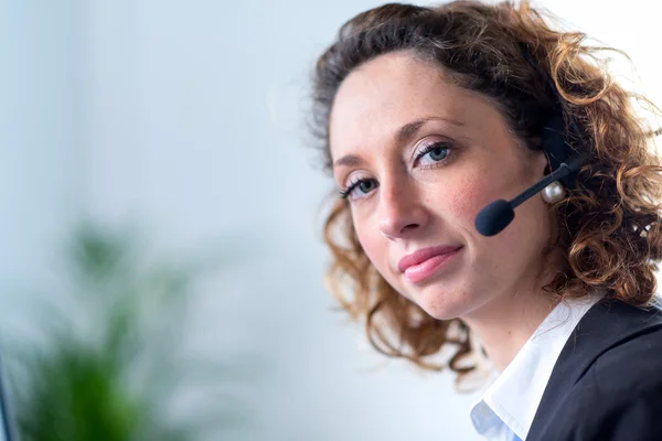 Portrait of an attractive young woman operator — Stock Photo, Image