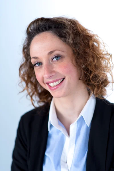 Portrait of a young executive woman on light backgroung — Stock Photo, Image