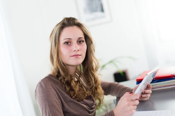 Portrait of a young student doing homework — Stock Photo, Image