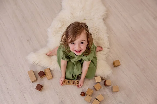 Top View Girl Who Holds Wooden Cubes Numbers 2022 Her — Stock Photo, Image