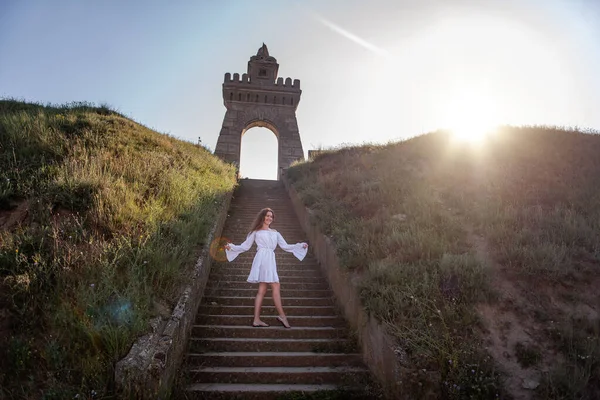 Young Happy Woman Dancing White Summer Dress Stands Concrete Staircase — Stockfoto