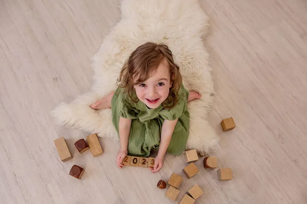 Top View Girl Who Holds Wooden Cubes Numbers 2023 Her — Stock Photo, Image