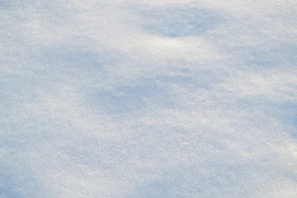 冬日阳光明媚冷冰冰的心情光滑的表面特写。雪的质地 — 图库照片