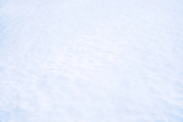 Superficie de nieve en primer plano. Día soleado de invierno, estado de ánimo helado. —  Fotos de Stock