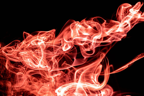 Orange color abstract smoke on black background