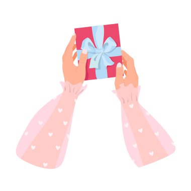 Hands wrapping gift box isolated on white background. A romantic gift.