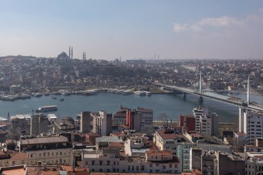 View from the Galata Tower to the western part of Istanbul, Golden Horn Strait, Eminonu district. Galata Bridge, Ataturk Bridge, filled with urban transport, various houses and mosques are visible