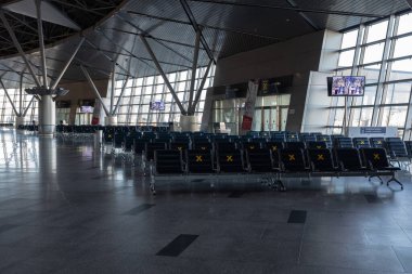 Moscow, Vnukovo Airport (VKO). March 1, 2020. A lot of seats in the airport's international terminal are completely empty. There are no passengers at the airport and no shops visitors.