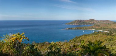 High resolution panoramic photo of viewpoint Zimbabwe point (Grand fond) at Praslin island of Seychelles. Endless oceanic landscape with rugged shoreline, sandy beaches and hills covered with jungle