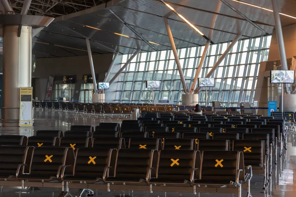 Moscow, Vnukovo Airport (VKO). March 1, 2020. A lot of seats in the airport's international terminal are completely empty. There are no passengers at the airport and no shops visitors.
