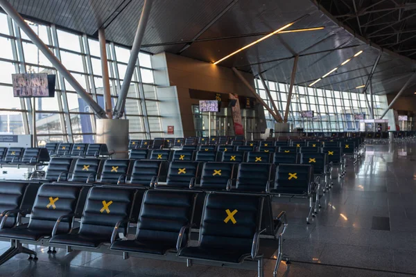 Moscow, Vnukovo Airport (VKO). March 1, 2020. A lot of seats in the airport's international terminal are completely empty. There are no passengers at the airport and no shops visitors.