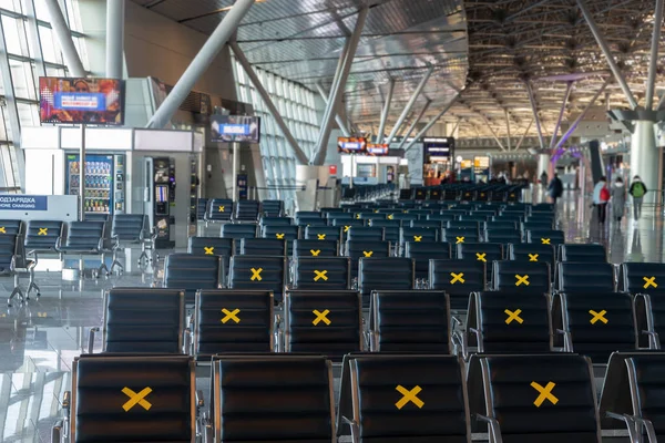 Moscow, Vnukovo Airport (VKO). March 1, 2020. A lot of seats in the airport's international terminal are completely empty. There are no passengers at the airport and no shops visitors.