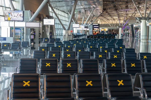 Moscow, Vnukovo Airport (VKO). March 1, 2020. A lot of seats in the airport's international terminal are completely empty. There are no passengers at the airport and no shops visitors.